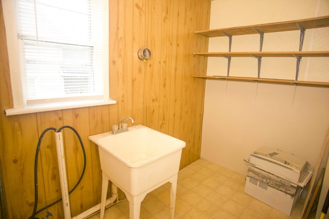 121 Houseman Ave NE, Grand Rapids, MI 49503 - laundry room with wooden walls