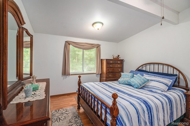 3277 Baldwin Rd, Metamora, MI 48455 - bedroom featuring wood finished floors and lofted ceiling
