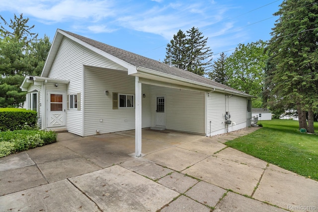 3277 Baldwin Rd, Metamora, MI 48455 - view of home's exterior featuring an attached carport, a lawn, driveway, and roof with shingles