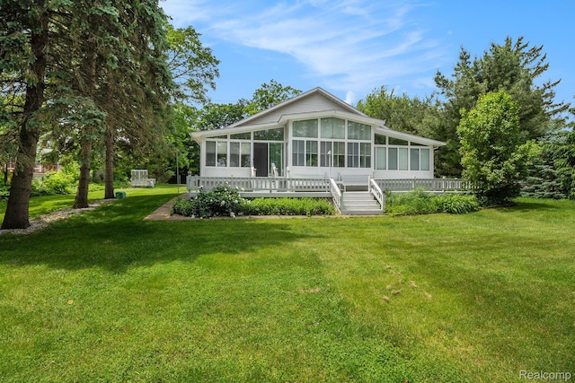 3277 Baldwin Rd, Metamora, MI 48455 - back of house featuring a sunroom and a lawn