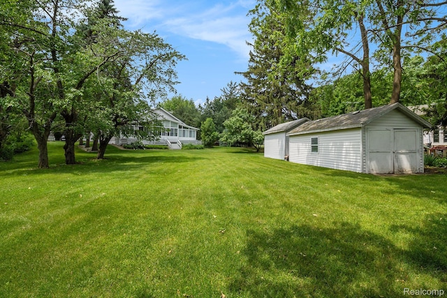 3277 Baldwin Rd, Metamora, MI 48455 - view of grassy yard featuring a storage unit