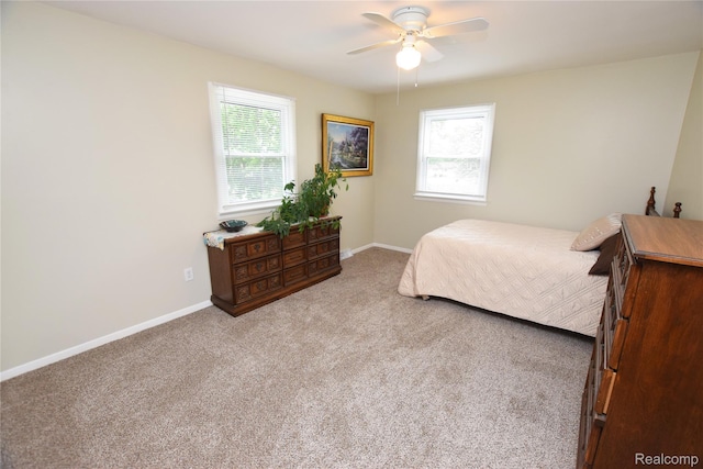 5483 Ameno Ln, Swartz Creek, MI 48473 - bedroom featuring multiple windows, carpet flooring, baseboards, and a ceiling fan