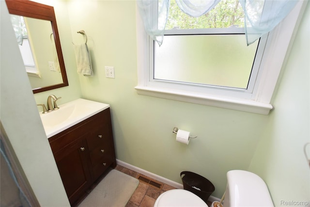 5483 Ameno Ln, Swartz Creek, MI 48473 - half bathroom with toilet, vanity, and baseboards