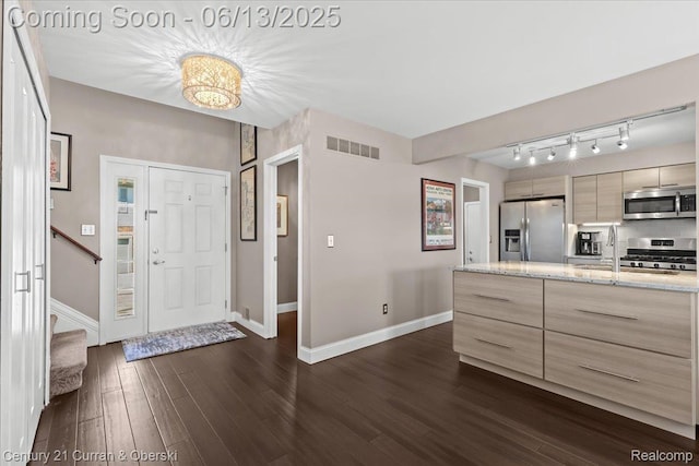 619 Winwood Cir, Walled Lake, MI 48390 - foyer featuring dark wood-style floors, stairway, and a chandelier