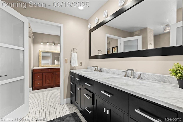 619 Winwood Cir, Walled Lake, MI 48390 - full bath with double vanity and tile patterned floors