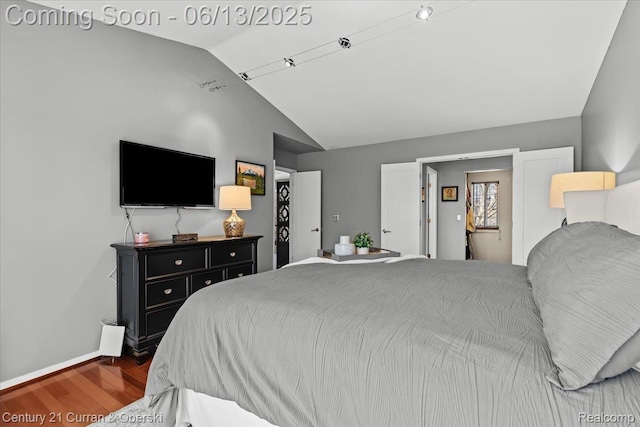 619 Winwood Cir, Walled Lake, MI 48390 - bedroom featuring vaulted ceiling and wood finished floors