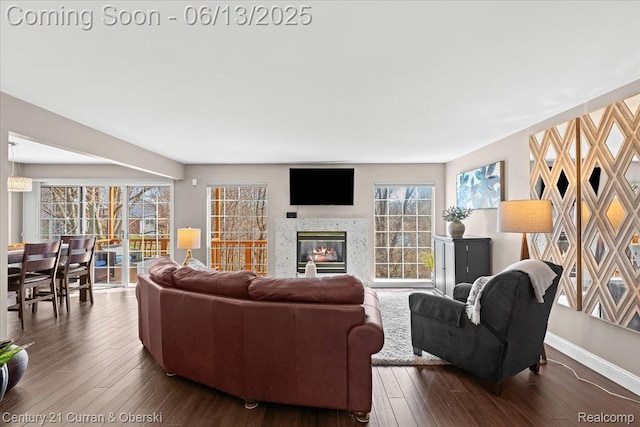619 Winwood Cir, Walled Lake, MI 48390 - living area with dark wood-type flooring and a glass covered fireplace