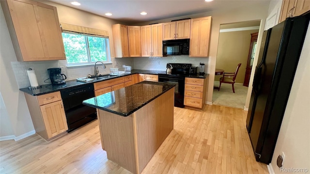763 Chemung Forest Dr, Howell, MI 48843 - kitchen featuring black appliances, light brown cabinetry, light wood-type flooring, recessed lighting, and tasteful backsplash