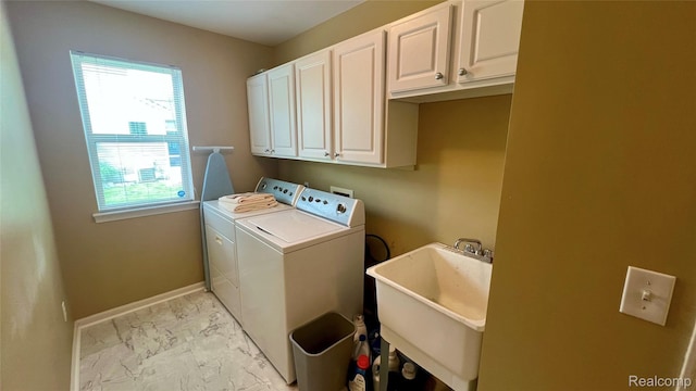 763 Chemung Forest Dr, Howell, MI 48843 - laundry area with light marble finish floors, cabinet space, washing machine and clothes dryer, and plenty of natural light