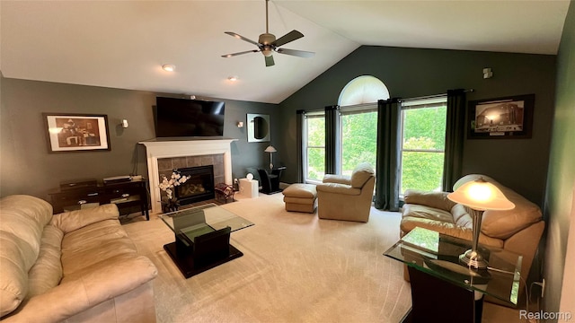 763 Chemung Forest Dr, Howell, MI 48843 - carpeted living area featuring a ceiling fan, vaulted ceiling, and a fireplace