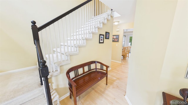 763 Chemung Forest Dr, Howell, MI 48843 - staircase with wood finished floors