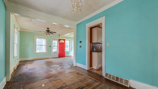 218 Clifford St, Lansing, MI 48912 - empty room featuring crown molding, wood-type flooring, a chandelier, a ceiling fan, and baseboard heating