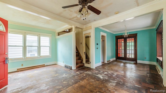 218 Clifford St, Lansing, MI 48912 - spare room featuring a baseboard radiator, stairs, french doors, ornamental molding, and hardwood / wood-style floors