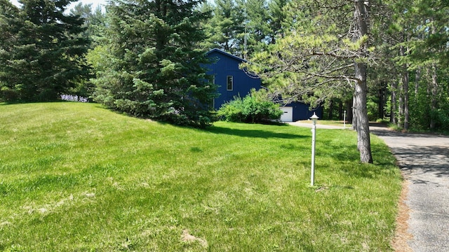 160 Wire Line Rd, Caro, MI 48723 - view of green lawn with driveway and an outbuilding