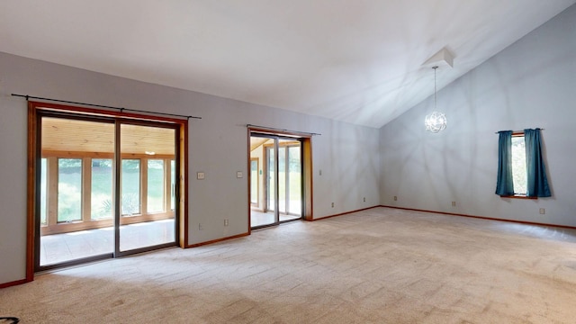 160 Wire Line Rd, Caro, MI 48723 - spare room featuring carpet floors, healthy amount of natural light, lofted ceiling, and a chandelier
