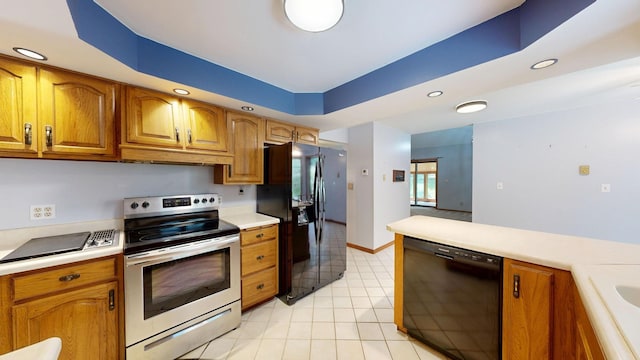 160 Wire Line Rd, Caro, MI 48723 - kitchen with black appliances, light countertops, brown cabinets, and recessed lighting