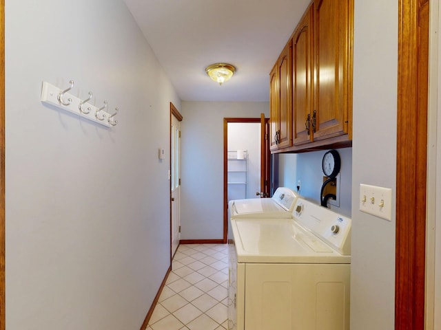 160 Wire Line Rd, Caro, MI 48723 - laundry room featuring cabinet space, washing machine and clothes dryer, light tile patterned flooring, and baseboards