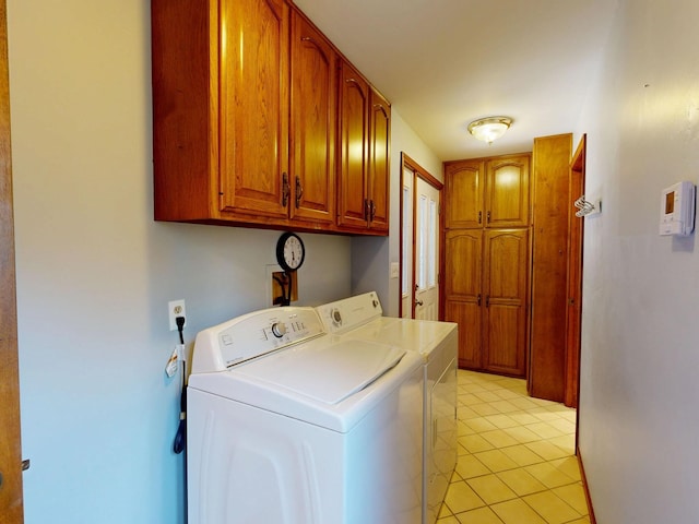 160 Wire Line Rd, Caro, MI 48723 - laundry area with cabinet space, washing machine and dryer, and light tile patterned floors