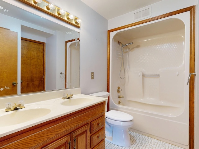 160 Wire Line Rd, Caro, MI 48723 - full bathroom with double vanity, toilet, tile patterned floors, and shower / tub combination