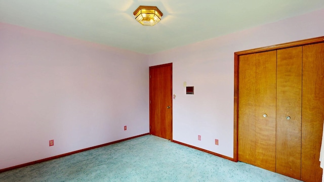 160 Wire Line Rd, Caro, MI 48723 - unfurnished bedroom featuring light colored carpet, baseboards, and a closet