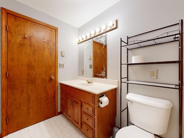 160 Wire Line Rd, Caro, MI 48723 - half bath with vanity, toilet, and tile patterned flooring
