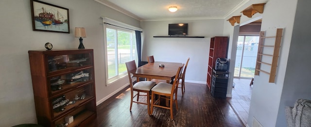 1781 Davis St, Muskegon, MI 49441 - dining room featuring dark wood finished floors, ornamental molding, and baseboards