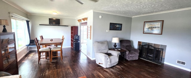 1781 Davis St, Muskegon, MI 49441 - dining space with wood finished floors, healthy amount of natural light, baseboards, and ornamental molding
