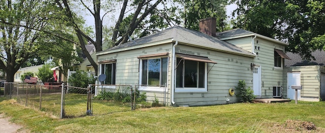 1781 Davis St, Muskegon, MI 49441 - view of side of home with a chimney and a shingled roof
