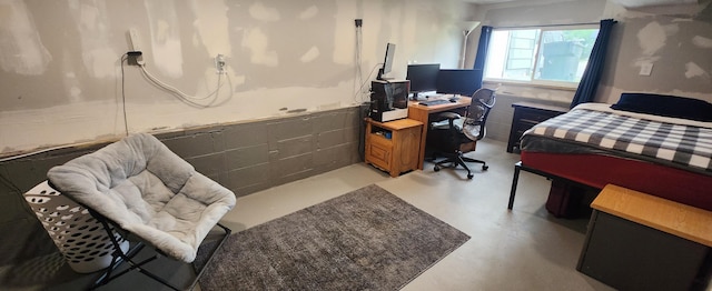 1781 Davis St, Muskegon, MI 49441 - bedroom featuring concrete floors and an office area