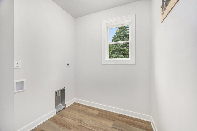LotA Chandler Drive Ne, Belmont, MI 49306 - washroom with hookup for an electric dryer, baseboards, and light wood finished floors