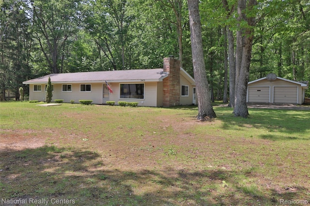 10475 W Higgins Lake Dr, Roscommon, MI 48653 - single story home with an outbuilding, a detached garage, a chimney, and a front lawn