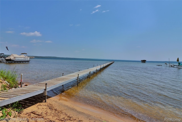 10475 W Higgins Lake Dr, Roscommon, MI 48653 - dock featuring a water view