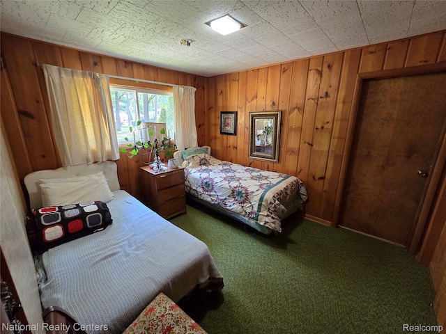 10475 W Higgins Lake Dr, Roscommon, MI 48653 - bedroom with carpet flooring and wooden walls