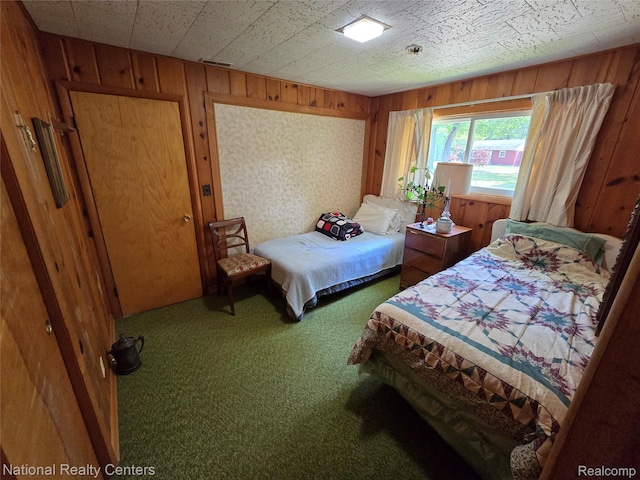 10475 W Higgins Lake Dr, Roscommon, MI 48653 - bedroom with carpet floors and wooden walls