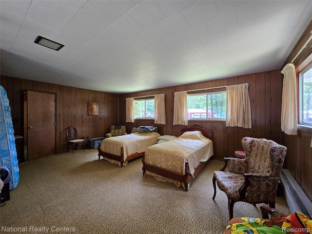 10475 W Higgins Lake Dr, Roscommon, MI 48653 - bedroom with wooden walls and carpet