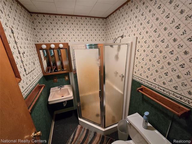 10475 W Higgins Lake Dr, Roscommon, MI 48653 - bathroom featuring wallpapered walls, a shower stall, and crown molding