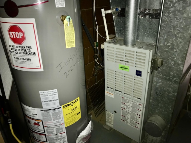 66223 Grey Lake Rd, Sturgis, MI 49091 - utility room with water heater and heating unit
