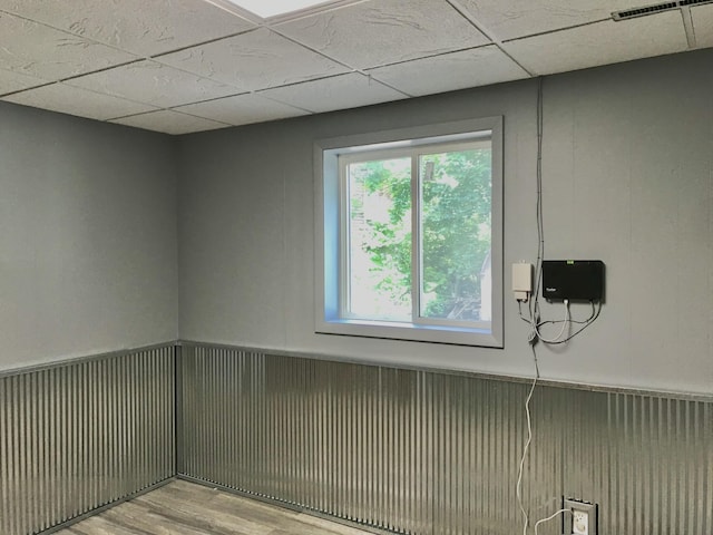 66223 Grey Lake Rd, Sturgis, MI 49091 - empty room featuring wood finished floors and a wainscoted wall