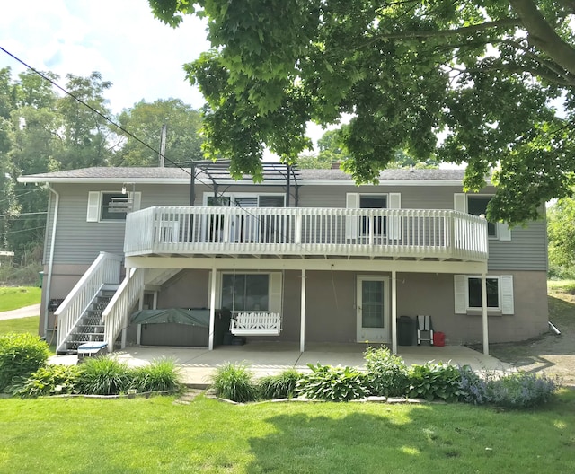 66223 Grey Lake Rd, Sturgis, MI 49091 - rear view of house featuring a yard, a patio, and a wooden deck