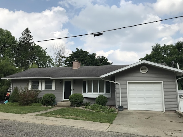 66223 Grey Lake Rd, Sturgis, MI 49091 - single story home featuring a garage, a chimney, concrete driveway, entry steps, and a front lawn