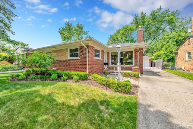 4006 Highfield Rd, Royal Oak, MI 48073 - ranch-style house with a chimney, brick siding, a front yard, and a gate