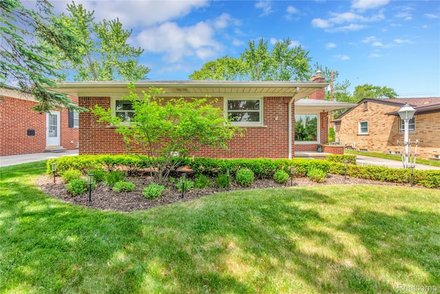 4006 Highfield Rd, Royal Oak, MI 48073 - view of front facade with a front lawn, brick siding, and a chimney