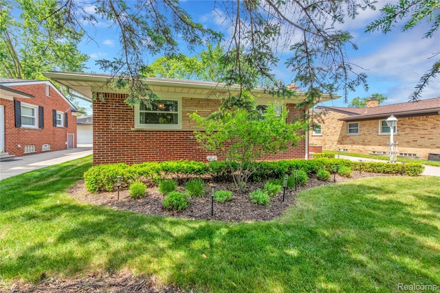 4006 Highfield Rd, Royal Oak, MI 48073 - view of property exterior with brick siding, a lawn, and an outdoor structure