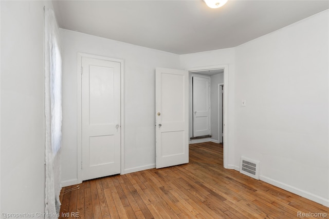 545 E Maplehurst St, Ferndale, MI 48220 - unfurnished bedroom with light wood-style floors