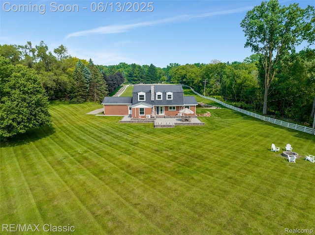 8173 Earhart Rd, South Lyon, MI 48178 - back of property featuring a patio and a view of trees