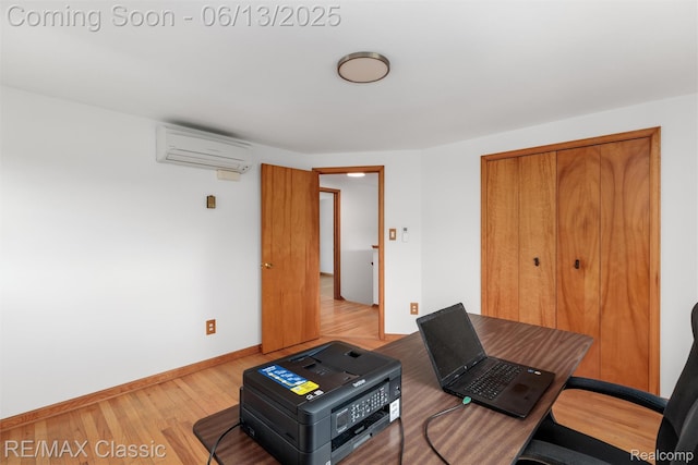 8173 Earhart Rd, South Lyon, MI 48178 - office featuring a wall unit AC, light wood-style floors, and baseboards