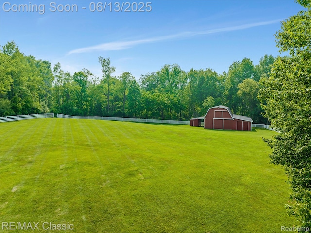 8173 Earhart Rd, South Lyon, MI 48178 - view of yard featuring a barn and an outbuilding