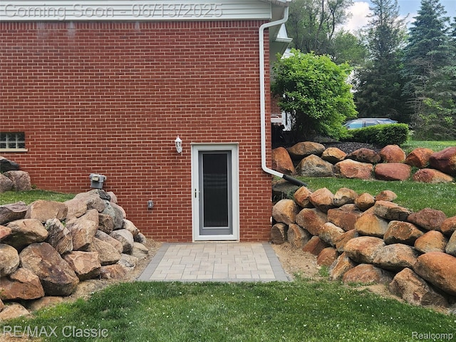 8173 Earhart Rd, South Lyon, MI 48178 - doorway to property with brick siding