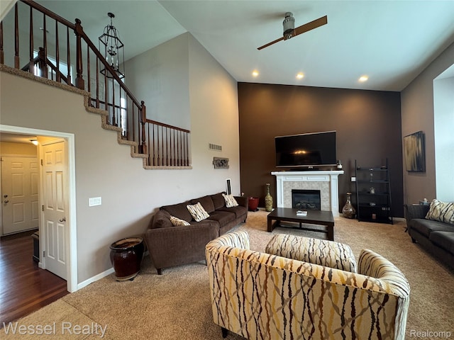14232 Berryknoll Dr, Shelby Twp, MI 48315 - living room featuring carpet, ceiling fan, a towering ceiling, stairs, and recessed lighting