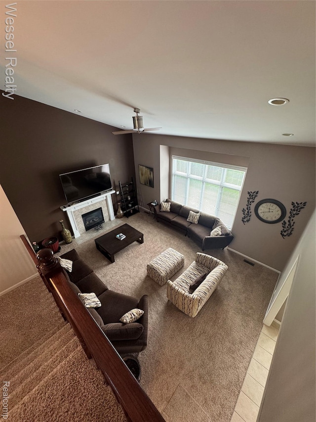 14232 Berryknoll Dr, Shelby Twp, MI 48315 - carpeted living room featuring a glass covered fireplace, a ceiling fan, recessed lighting, and tile patterned floors